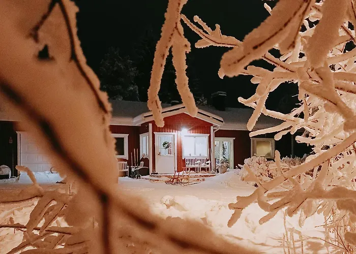 Red Wooden House In Рованиеми