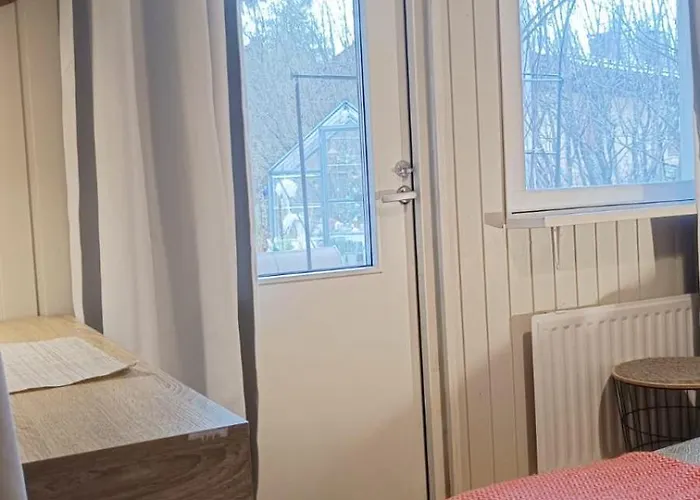 Red Wooden House In Рованиеми